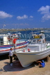 CYPRUS, Paphos, Kato Paphos, boatyard, men painting fishing boat, CYP495JPL