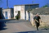 CYPRUS, Paphos area villages, DROUSIA, street, and man carrying firewood, CYP446JPL