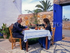CYPRUS, Sotira village (near Aiya Napa), outdoor restaurant, taverna, couple at table, CYP512JPL