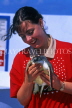 Cayman Islands, GRAND CAYMAN, Cayman Turtle Farm, girl holding turtle, CAY58JPL