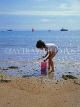 Channel Islands, JERSEY, boy playing on beach, with bucket and spade, UK10377JPL