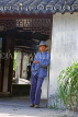 China, BEIJING, man standing by doorway, CH1695JPL