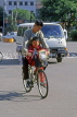 China, BEIJING, street scene, man riding bicycle, with child in front, CH1426JPL