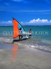 DOMINICAN REPUBLIC, North Coast, Playa Dorada, carrying windsurf out to sea, DR103JPL