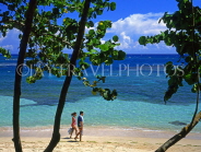DOMINICAN REPUBLIC, North Coast, Playa Dorada, couple walking along beach, DR256JPL