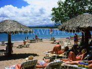 DOMINICAN REPUBLIC, North Coast, Playa Dorada, sunbathers and sunshades, DR269JPL