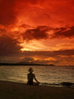 DOMINICAN REPUBLIC, North Coast, Playa Dorada, sunset and tourist on beach, DR105JPL