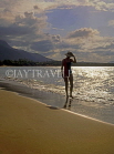 DOMINICAN REPUBLIC, North Coast, Playa Dorada, tourist walking along beach, DR181JPL