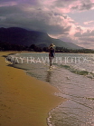 DOMINICAN REPUBLIC, North Coast, Playa Dorada, tourist walking along beach, dusk, DR262JPL