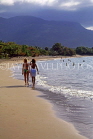 DOMINICAN REPUBLIC, North Coast, Playa Dorada, tourists walking along beach, DR322JPL