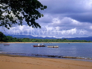 DOMINICAN REPUBLIC, North Coast, Puerto Plata coast, people in small boat, DR236JPL