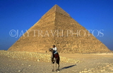 EGYPT, Giza, Pyramid and man on camel, EGY132JPL