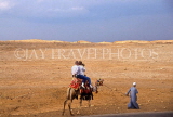 EGYPT, Giza, tourist couple on camel ride, EGY323JPL