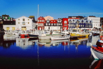 FAROE ISLANDS, Streymoy, Torshavn, waterfront buildings, and harbour boats, FAR74JPL