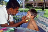 FIJI, Viti Levu, Nadi Bay area, child (tourist) having face painting, FIJ765JPL