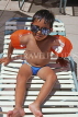 FIJI, Viti Levu, Nadi Bay area, child (tourist) on sunbed, FIJ772JPL
