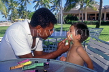FIJI, Viti Levu, Nadi Bay area, child having face painting, near Sheraton Hotel, FIJ667JPL