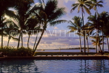 FIJI, Viti Levu, Yanuka Island, sunset view through pool and coconut trees, FIJ768JPL
