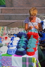 FINLAND, Helsinki, Market Square, stallholder knitting woollens, FIN829JPL