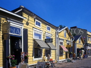 FINLAND, Porvoo, row of small shops along cobblestone street, FIN769JPL