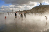 FRANCE, Aquitaine, BORDEAUX, Place de la Bourse, people walking through the mirror pool, FRA2156JPL