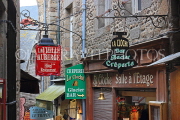 FRANCE, Normandy, MONT SAINT-MICHEL, narrow streets, hotel & restaurant signs, FRA2791JPL