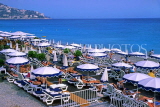 FRANCE, Provence, Cote d'Azure, NICE, sunbathers and parasols on beach, FRA473JPL