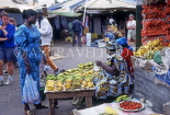 GAMBIA, Banjul, Albert Market, shopper at banana stall, GAM977JPL