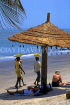 GAMBIA, Banjul, beach, sunshade, sunbathers and fruit sellers, GAM1047JPL