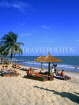 GAMBIA, Banjul, beach with sunbathers and thatched sunshadesb GAM813JPL
