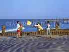 GAMBIA, Gambian children and tourist (boy) playing with ball on beach, GAM900JPL