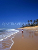 GAMBIA, Kotu Beach, boy walking along beach, GAM819JPL