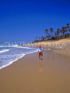 GAMBIA, Kotu Beach, boy walking along beach, GAM820JPL