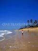 GAMBIA, Kotu Beach, boy walking along beach, GAM824JPL