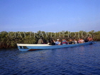 GAMBIA, River Gambia, tourists in dug out canoe (pirogue) on bird watching tour, GAM863JPL