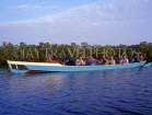 GAMBIA, River Gambia, tourists in dug out canoe (pirogue) on bird watching tour, GAM864JPL
