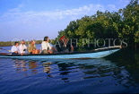 GAMBIA, River Gambia, tourists in dug out canoe (pirogues) on bird watching tour, GAM934JPL