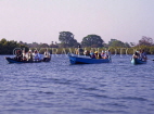 GAMBIA, River Gambia, tourists in dug out canoes (pirogues) on bird watching tour, GAM862JPL