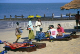 GAMBIA, fruit sellers with tourists, on beach, GAM908JPL