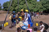 GAMBIA, rural scene, people working village pump, GAM998JPL