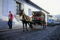 GUATEMALA, Antigua, horse drawn carriage, street scene, GUA277JPL