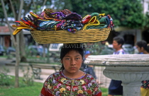 GUATEMALA, Antigua, woman selling purses (basket balancing on head), GUA402JPL