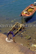 Greek Islands, KOS, Kos Town, fisherman cleaning Octopus, GIS1238JPL