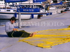 Greek Islands, KOS, Kos Town, fisherman mending net, harbourfront, GIS1032JPL