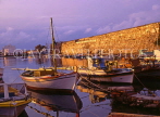 Greek Islands, KOS, Kos Town, harbourfront fishing boats, sunset on castle walls, GIS1024JPL