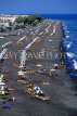 Greek Islands, SANTORINI, Kamari beach and sunbathers, GIS648JPL