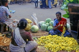 INDIA, South India, MADRAS, vendor making flower garlands (for temple offerings), IND942JPL