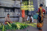 INDIA, South India, MADRAS, vendors making coconut leaf garlands (temple offerings), IND945JPL