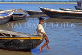 INDIA, Uttar Pradesh, VARANASI, child sitting on boat, River Ganges, IND591JPL