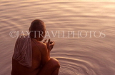 INDIA, Uttar Pradesh, VARANASI, pilgrim praying at River Ganges (at dawn), IND598JPL